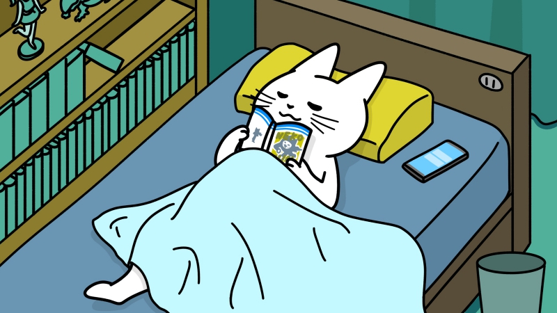 ベッドで寝ながら漫画を読む猫のイラスト